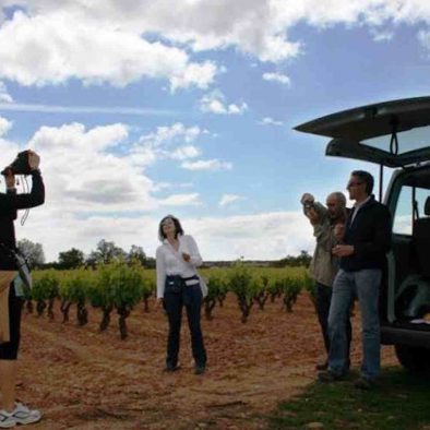 Group having fun in vineyard